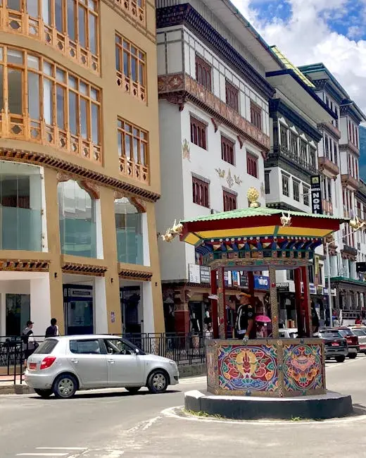 Colorful traditional architecture and vibrant traffic scene in Thimphu, Bhutan.